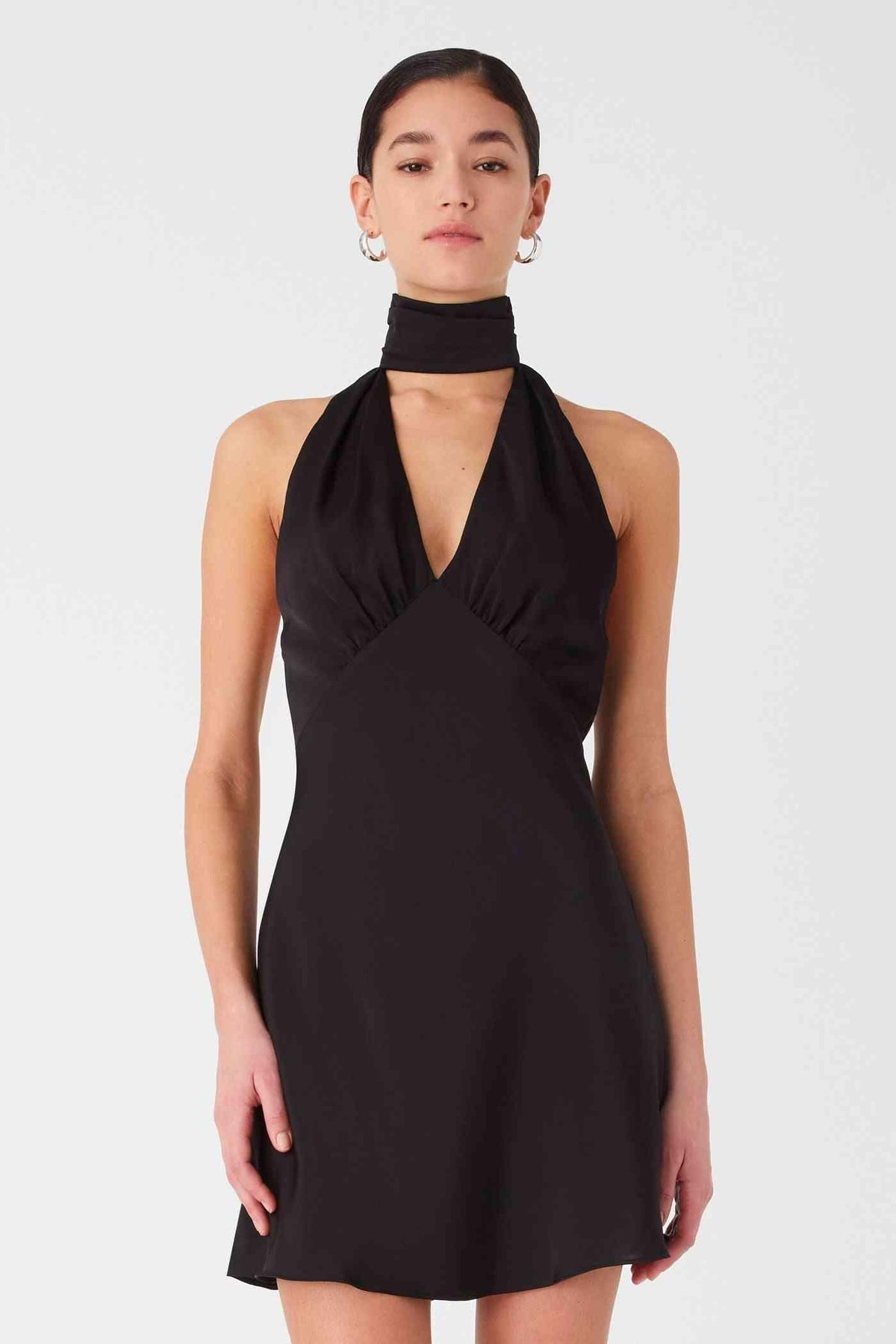 Black halter satin mini dress with deep V neckline and short flared hem