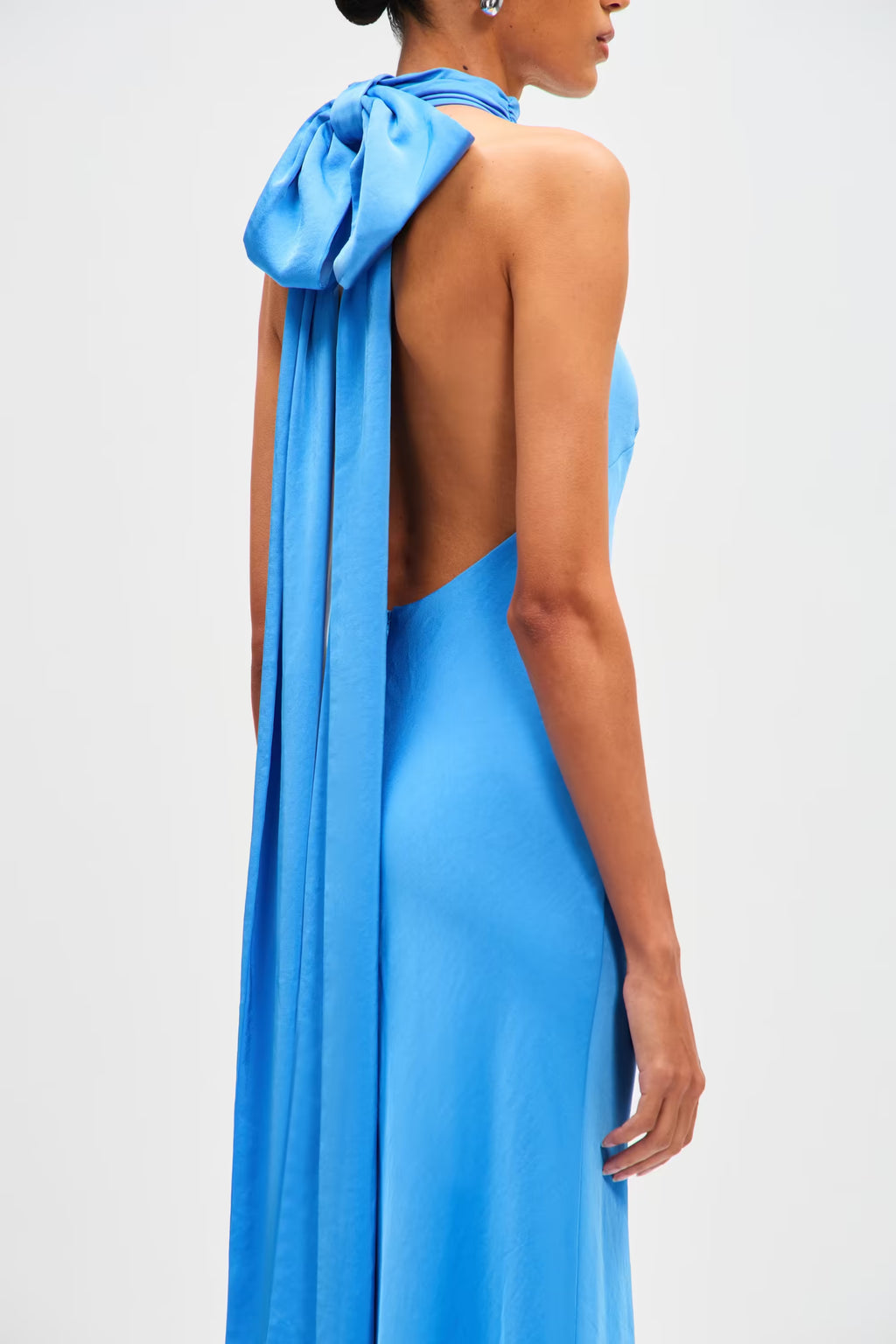 Lapis blue satin halter maxi dress side back with open back and bow tie