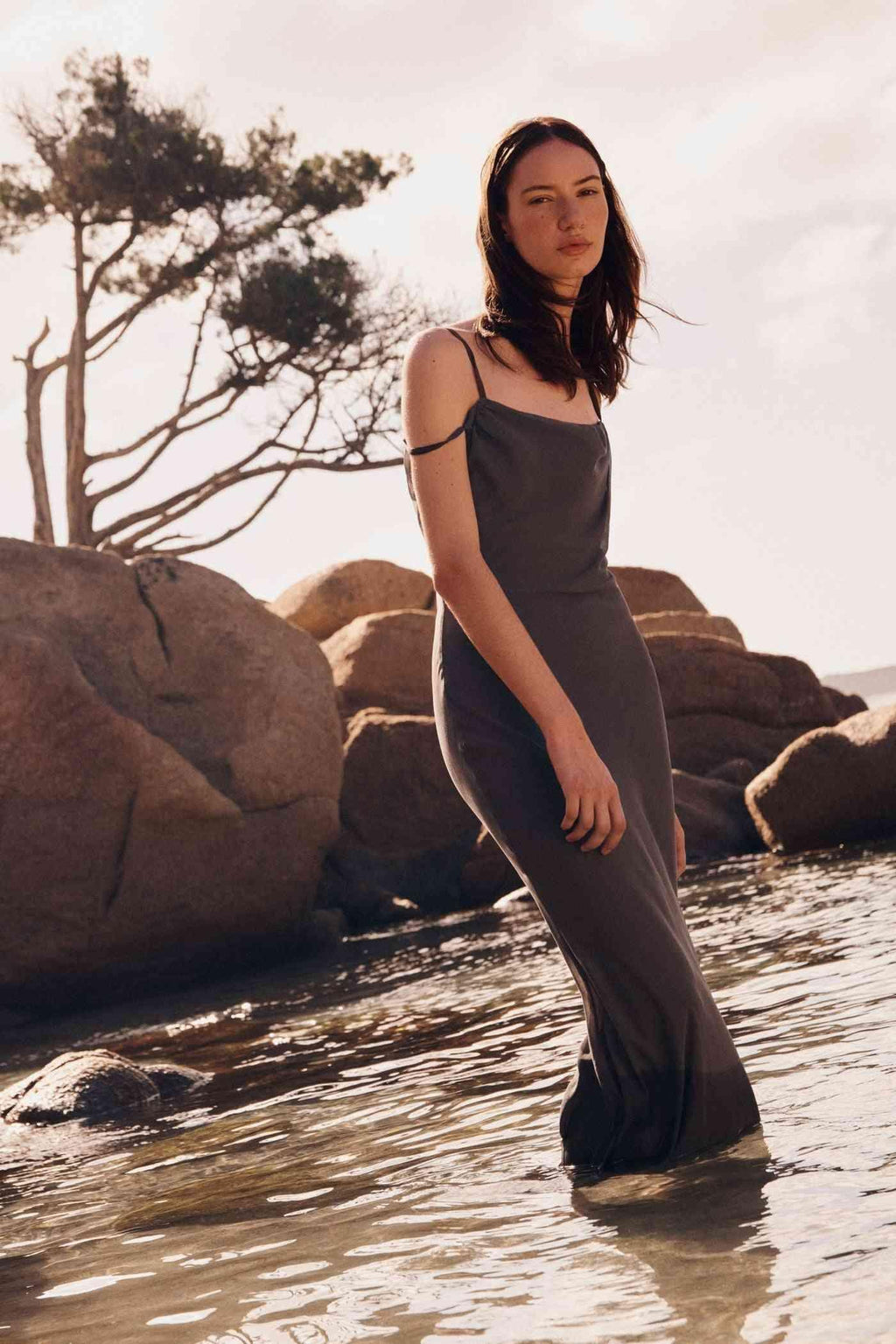 Gull grey maxi dress with thin straps and draped neckline, full-length front