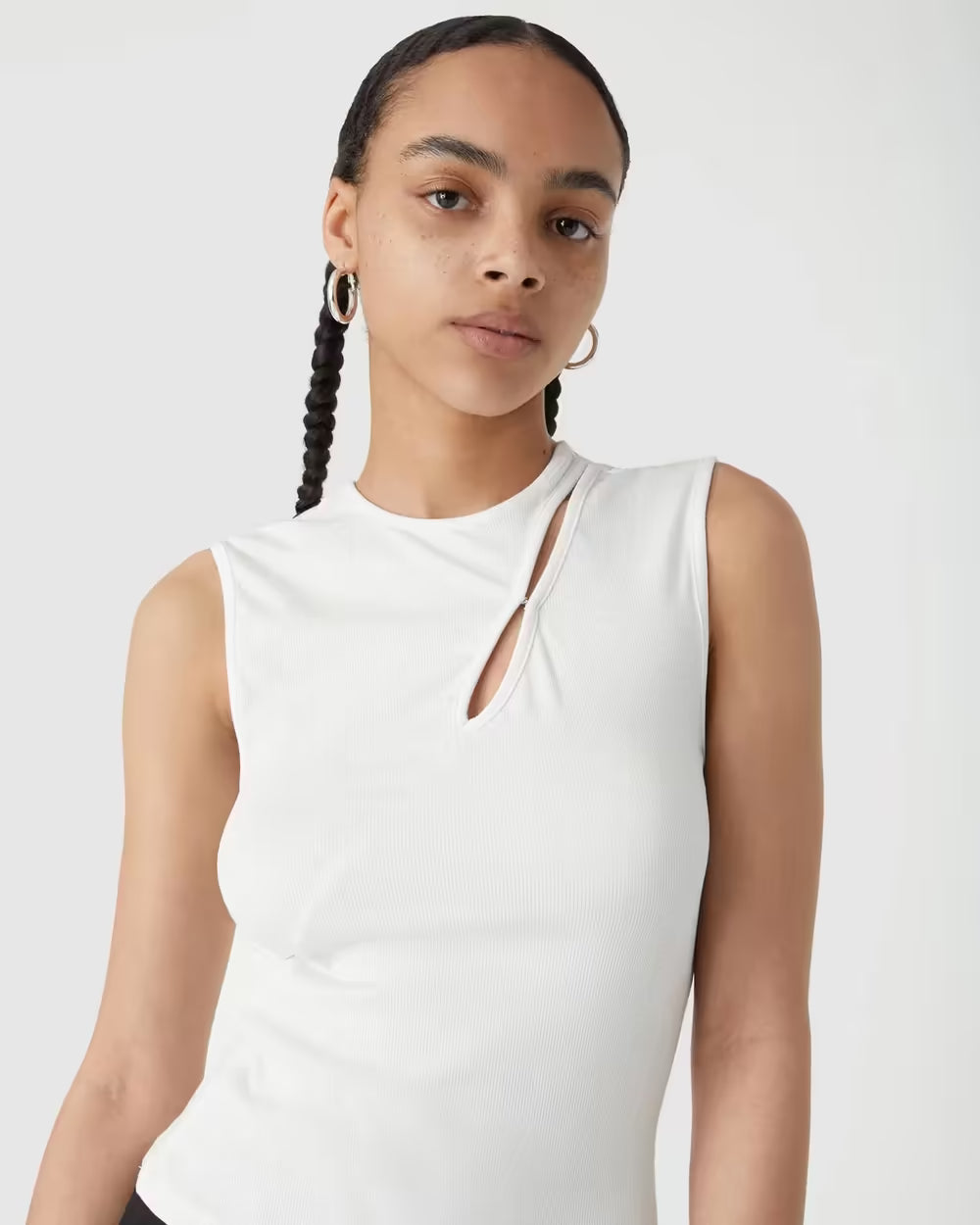 Ivory ribbed jersey tank top close-up with racerback and keyhole cutout