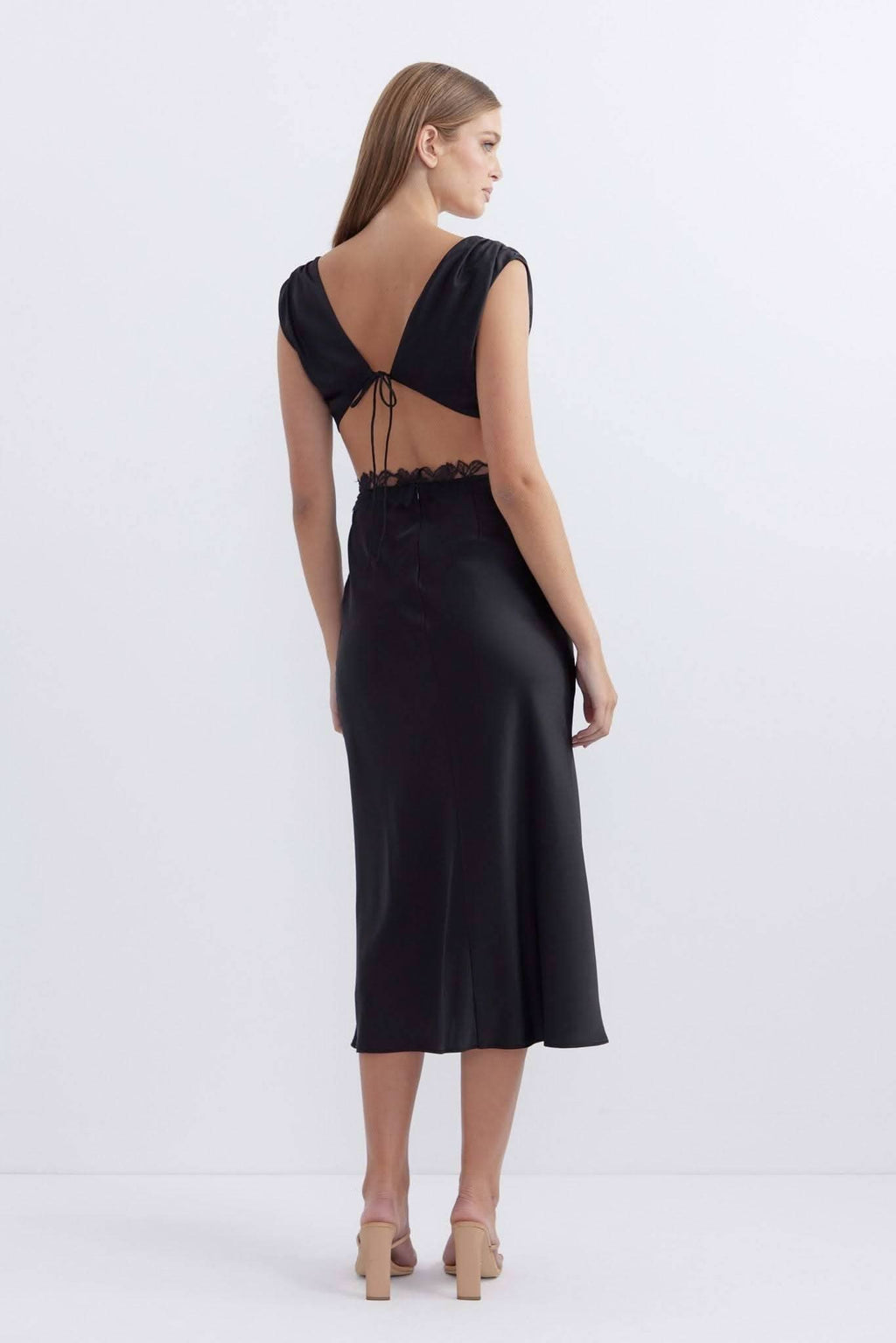 Black satin midi dress, open back with tie detail and lace trim at hem.