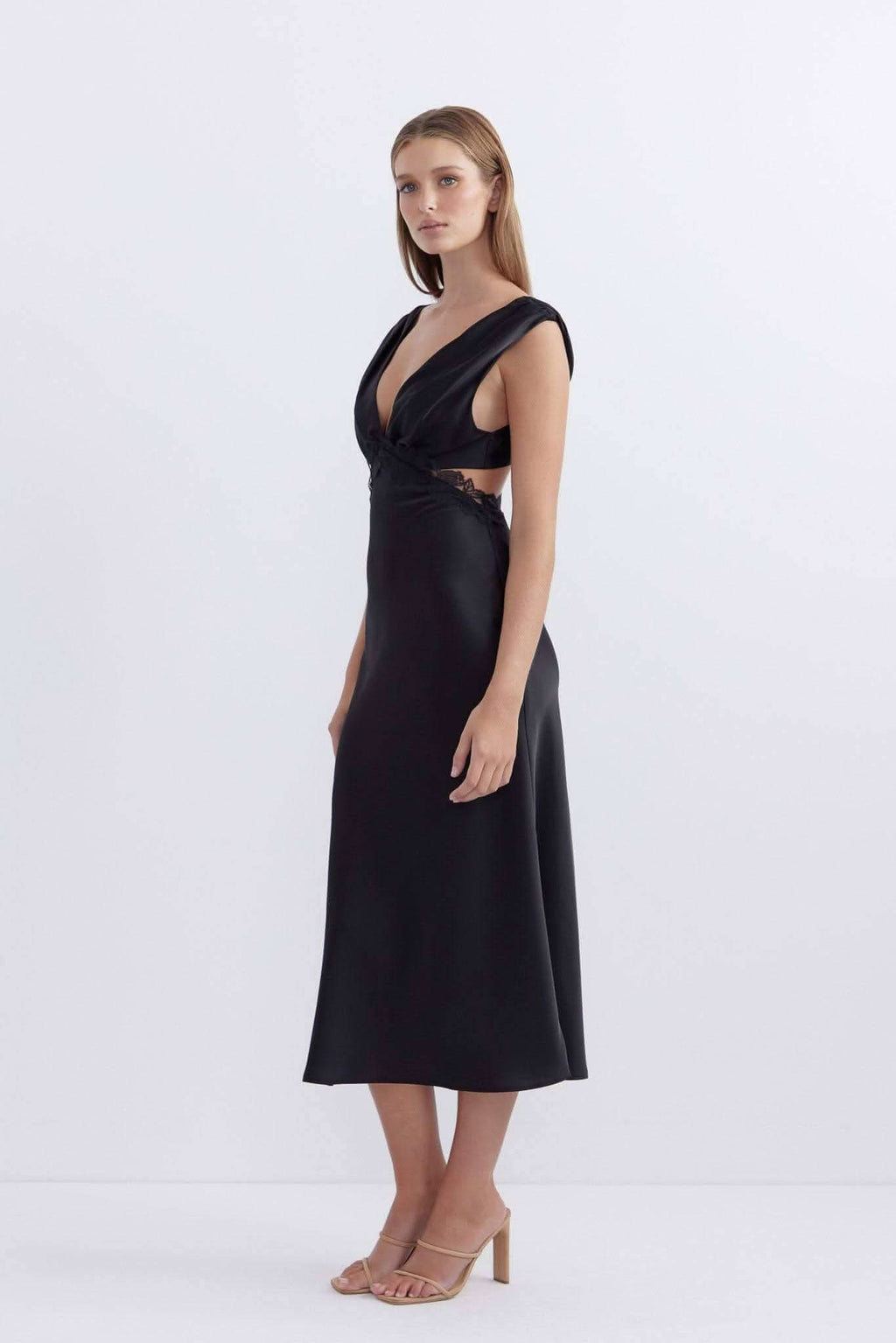 Black satin midi dress with deep V-neck and draped twist front, sleeveless.