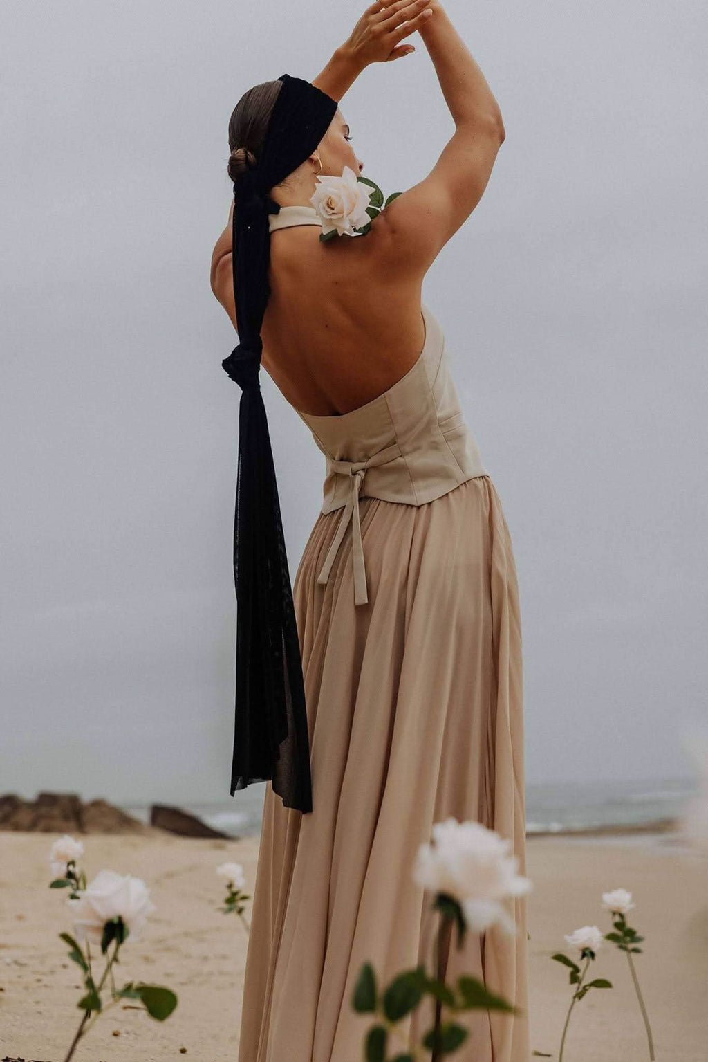 Stone halter vest with button-front and back waist tie detail, sleeveless