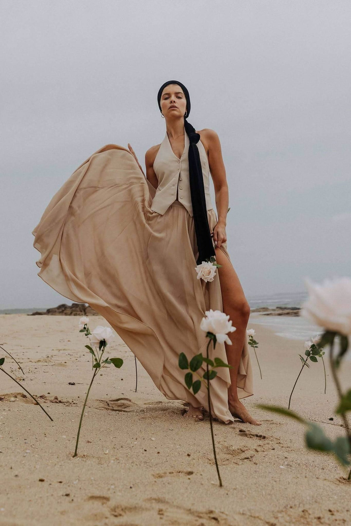 Stone halter vest with V neckline and draped back panel detail, sleeveless