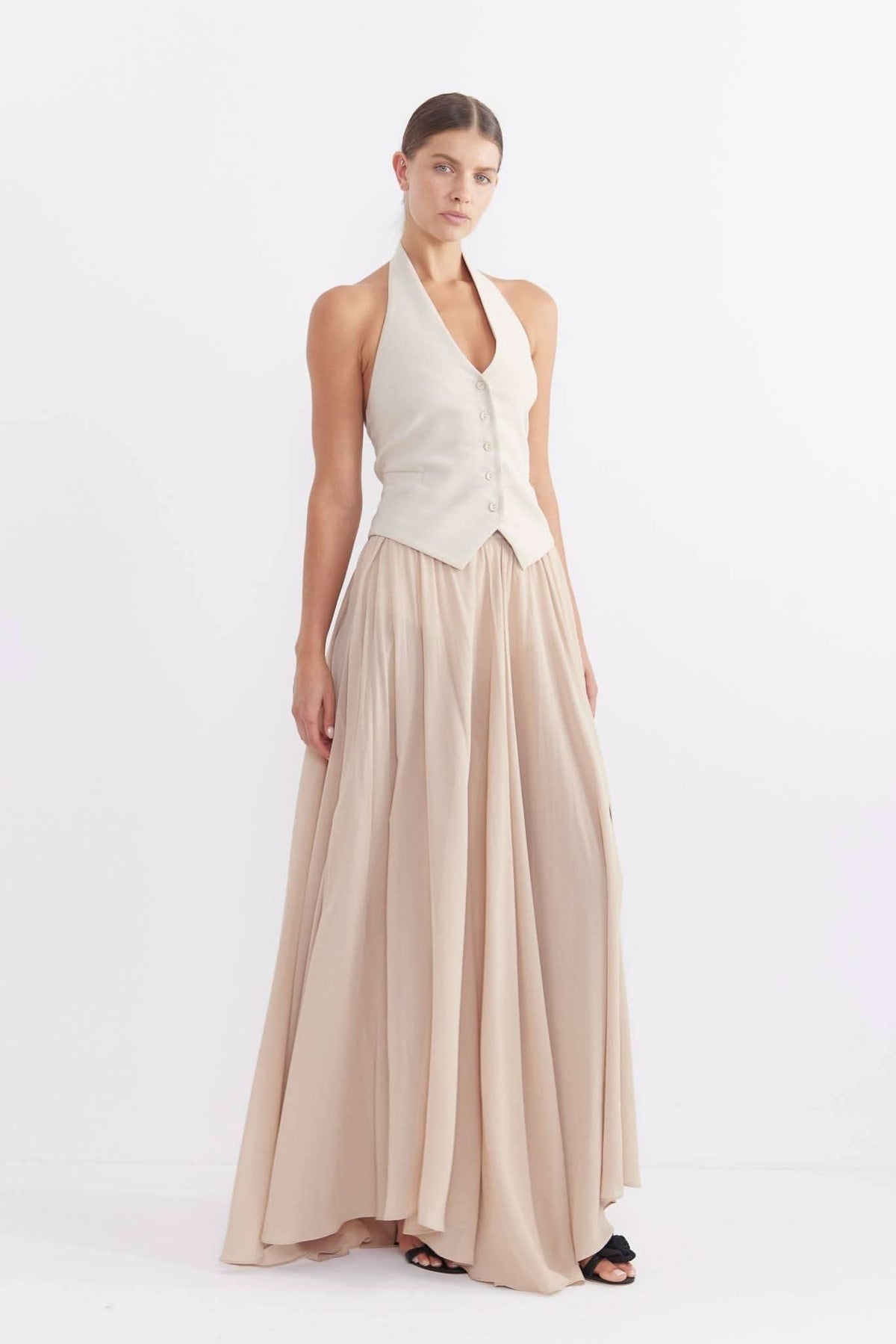 Stone halter vest with button-front closure and V neckline, sleeveless