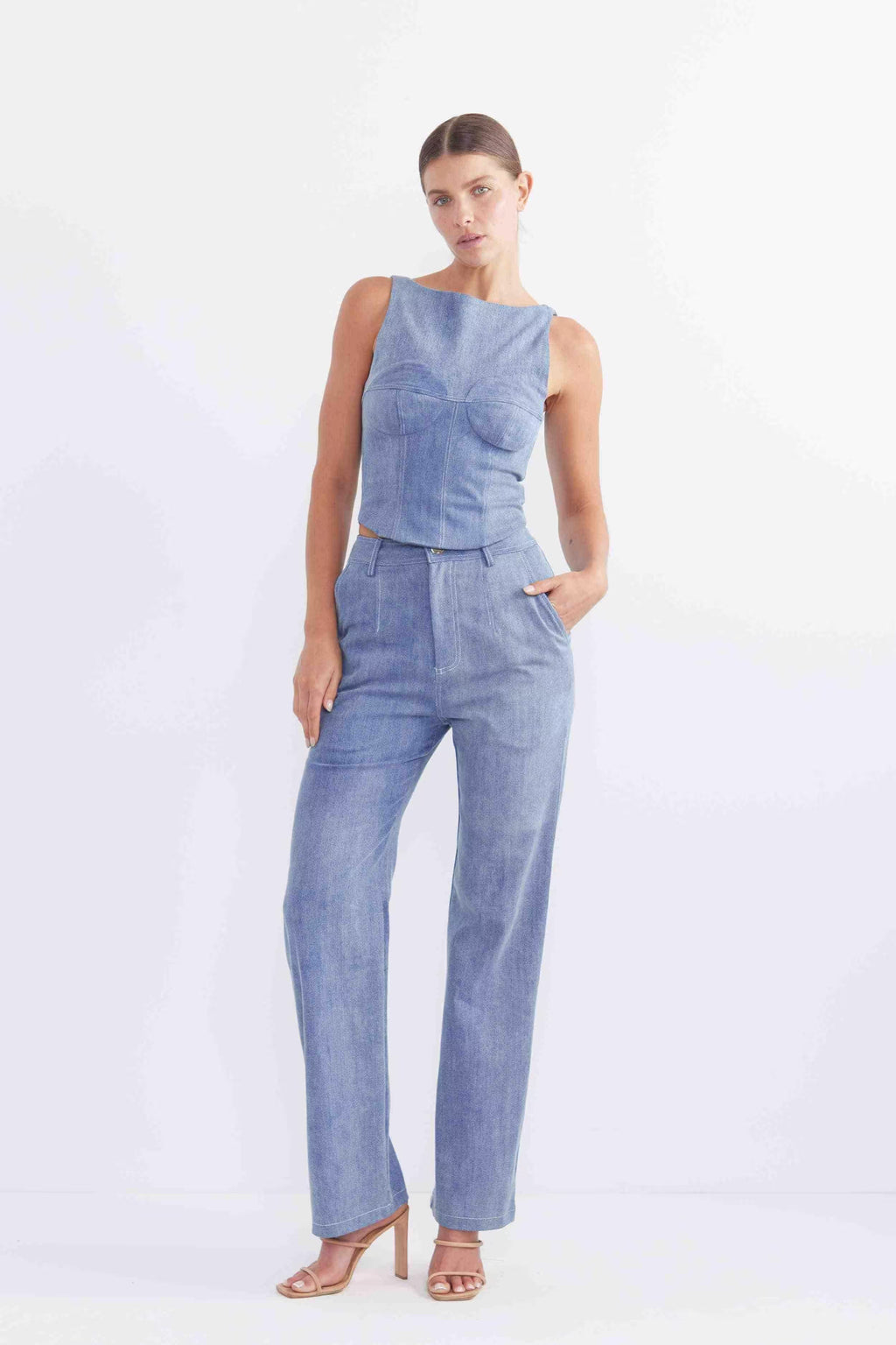 Sleeveless blue denim bodice with waist peplum and tailored seam lines