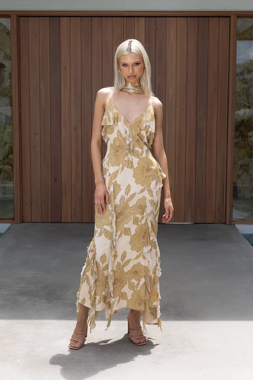 Golden midi dress with spaghetti straps, V-neck front, and cascading ruffle hem