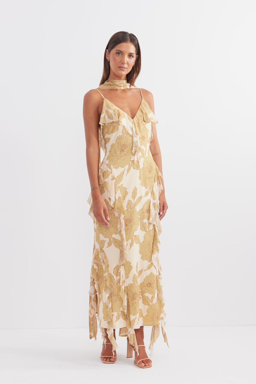 Golden midi dress with thin straps, V-neckline, and cascading ruffle layers
