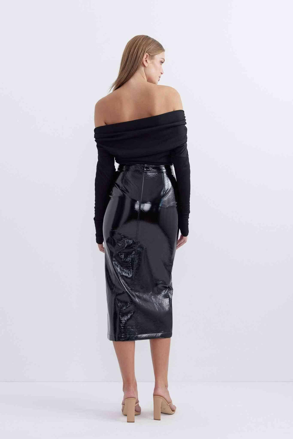 Patent black midi skirt with fitted waist and draped back detail