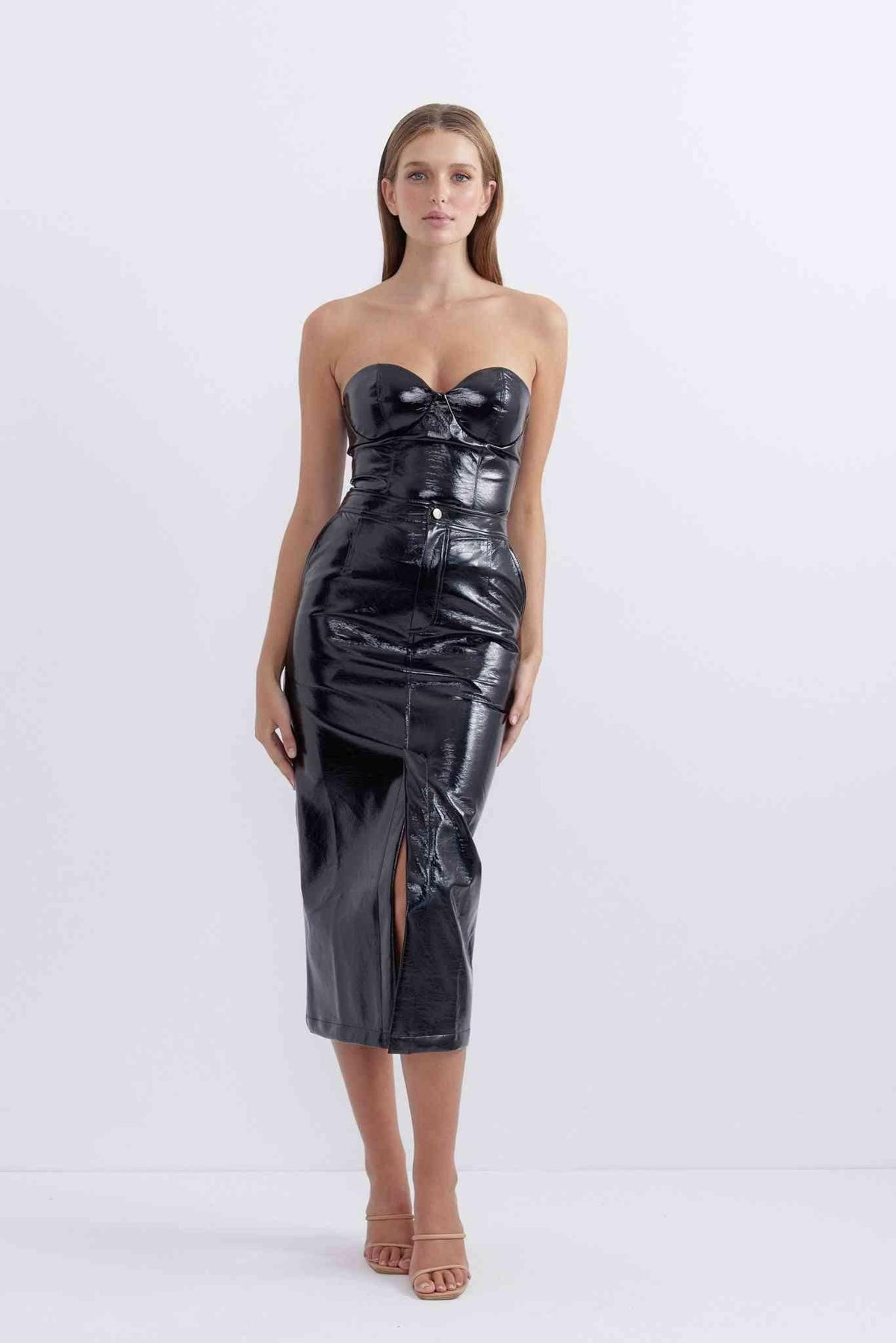 Glossy patent black midi skirt with structured front panels and front slit