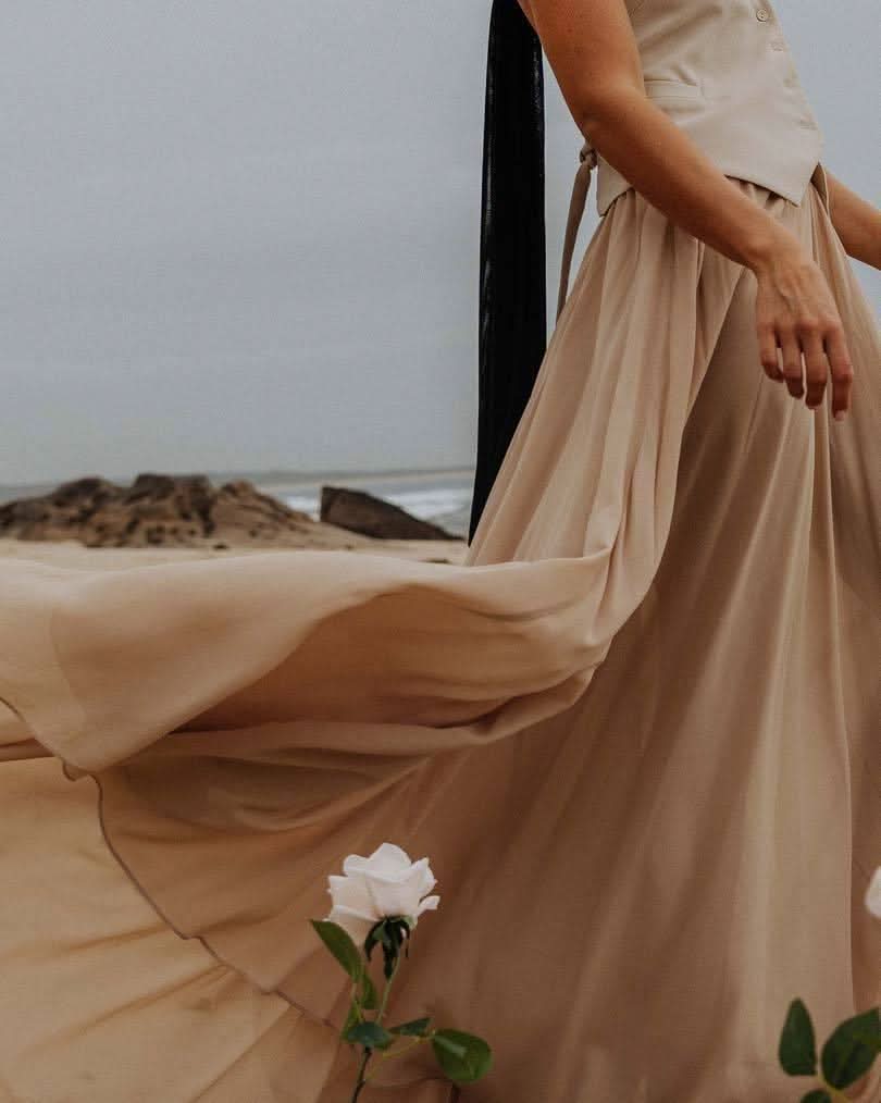 Stone maxi skirt with soft pleats and front drape detail