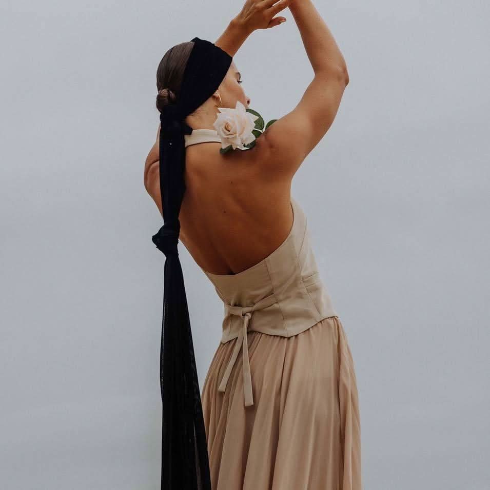 Stone maxi skirt with gathered pleats and waist tie, draped back view