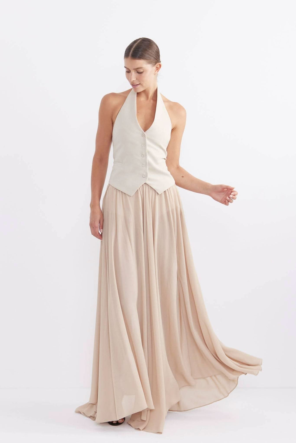 Stone maxi skirt with gathered pleats, flowy drape, and long hem