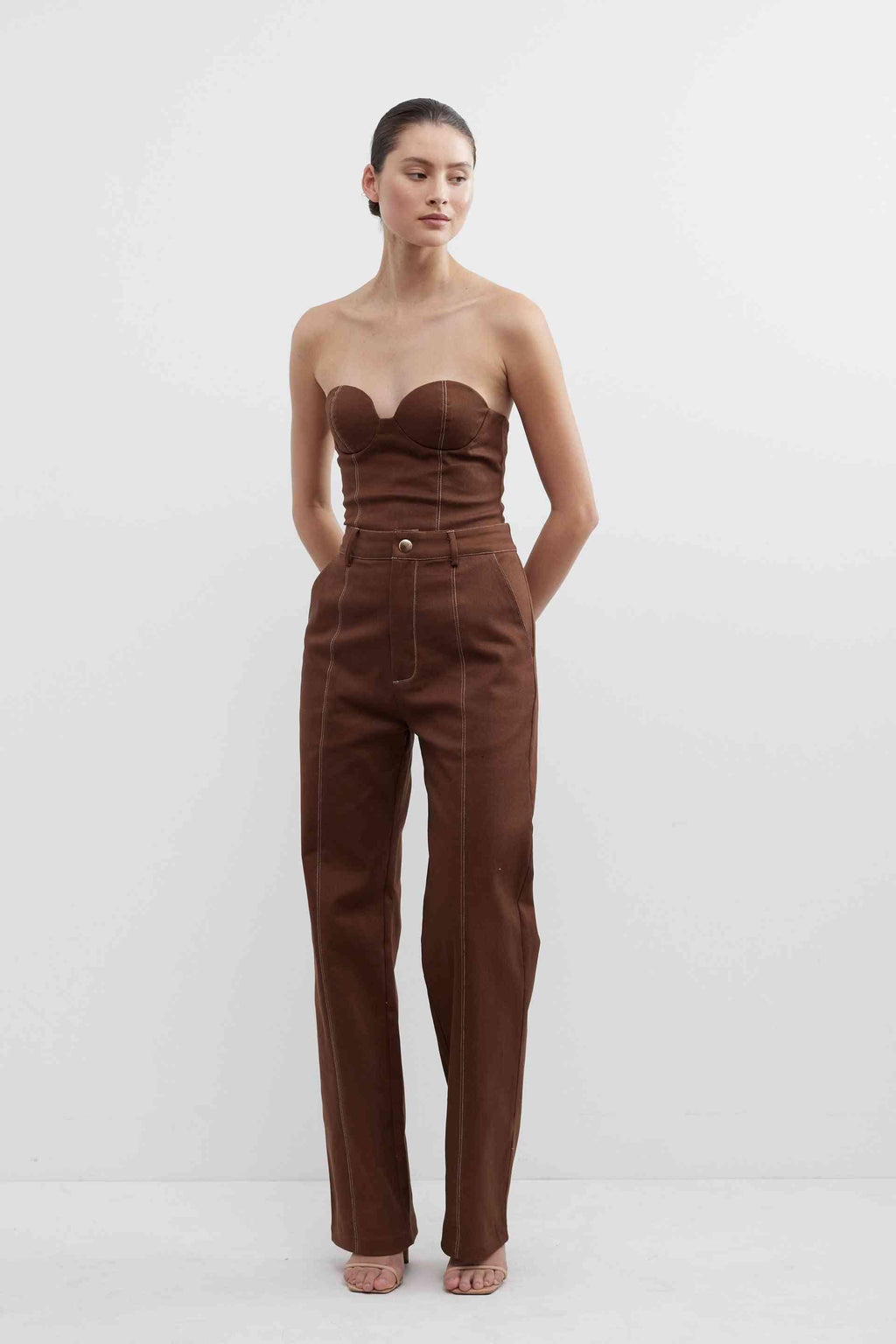 Fudge brown high-waist pants with belt loops, button closure, and straight legs