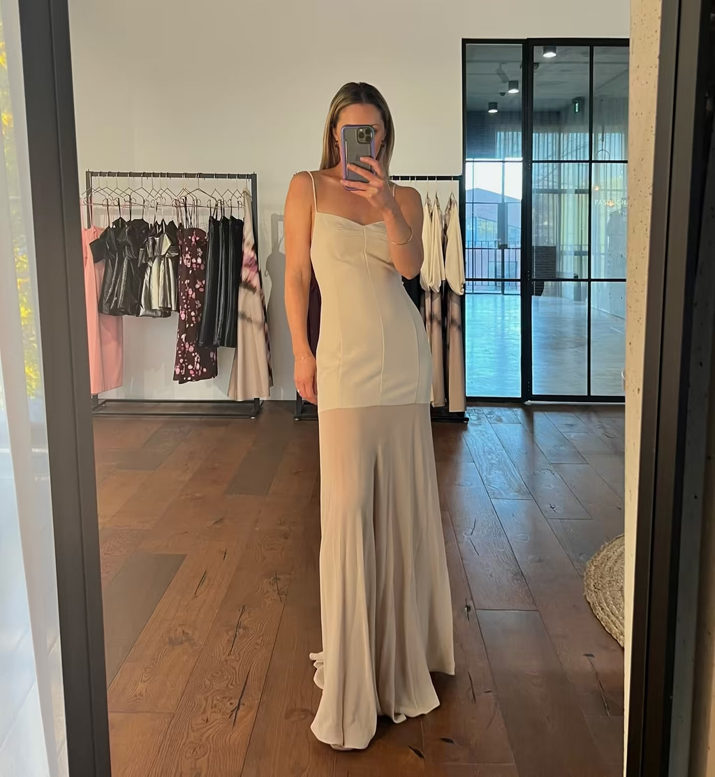 Stone spaghetti-strap maxi dress with fitted bodice and draped, flowy skirt