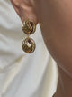 a close up of a person wearing a pair of Luv Aj The Leila Drop Earrings