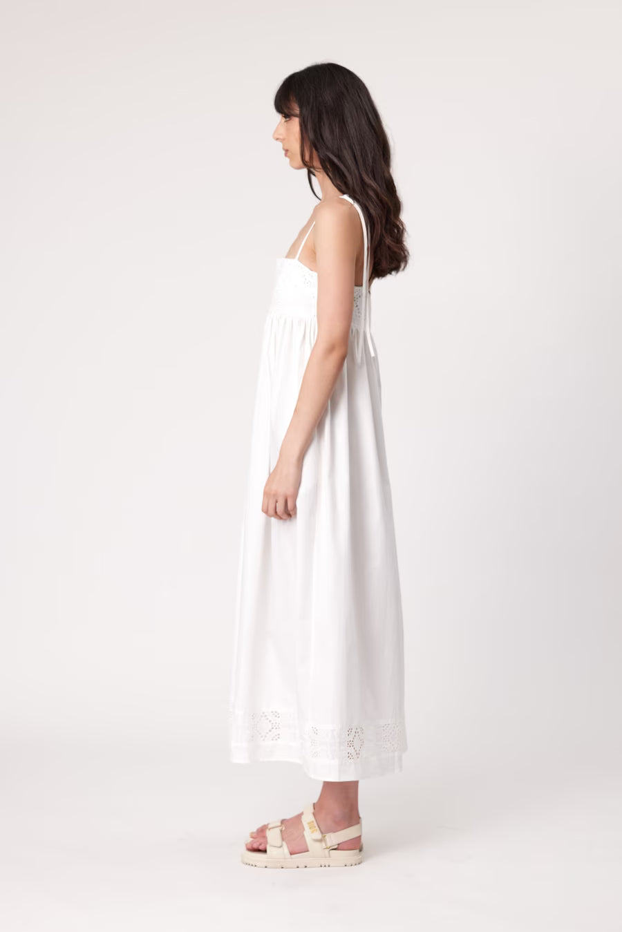 Ivory maxi dress side/back view with spaghetti straps and scalloped lace trim
