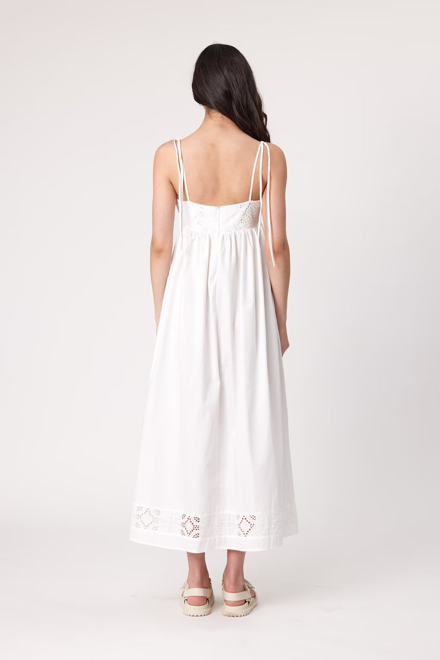 Ivory maxi dress back view with spaghetti straps and lace-trimmed hem
