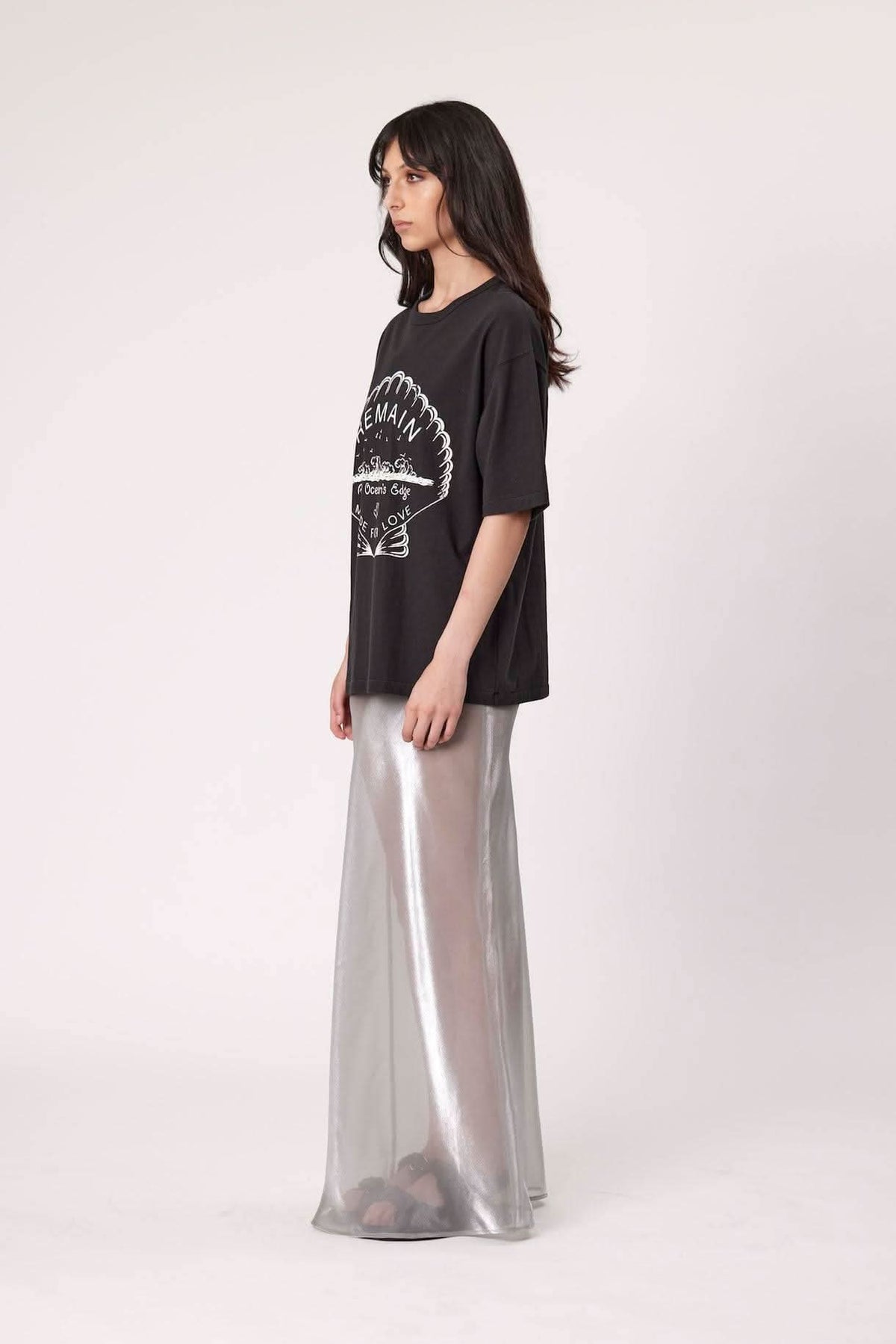 Washed black graphic tee with front emblem print and short sleeves