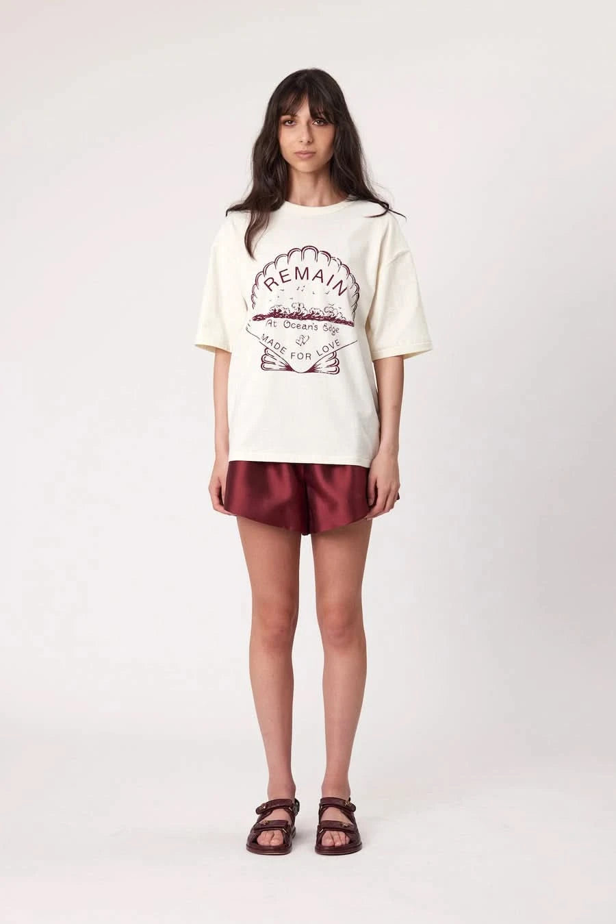 Bone short-sleeve T-shirt with 'REMAIN' arched graphic print