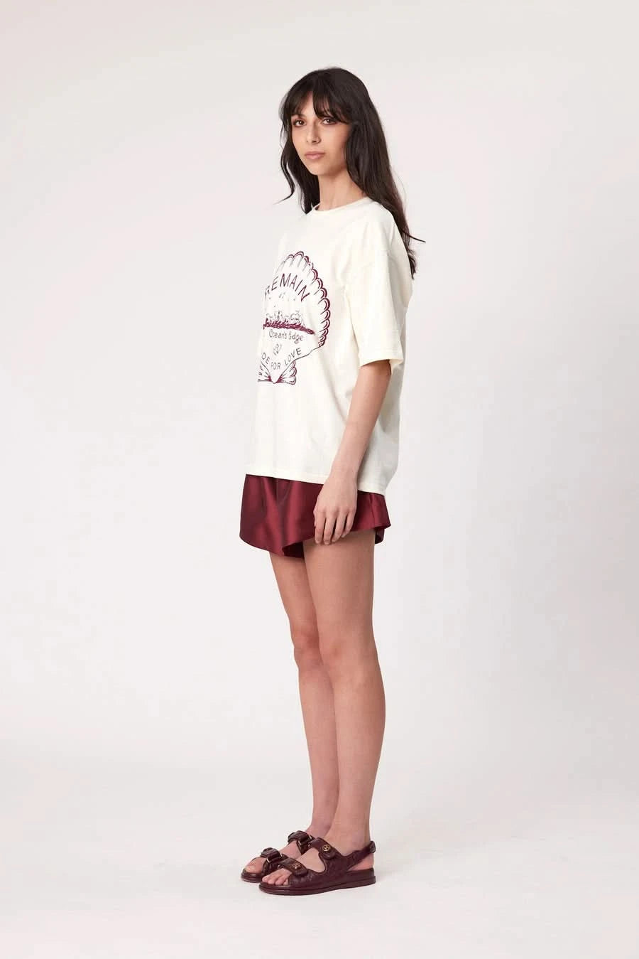 Bone short-sleeve T-shirt with 'REMAIN' graphic print, side view