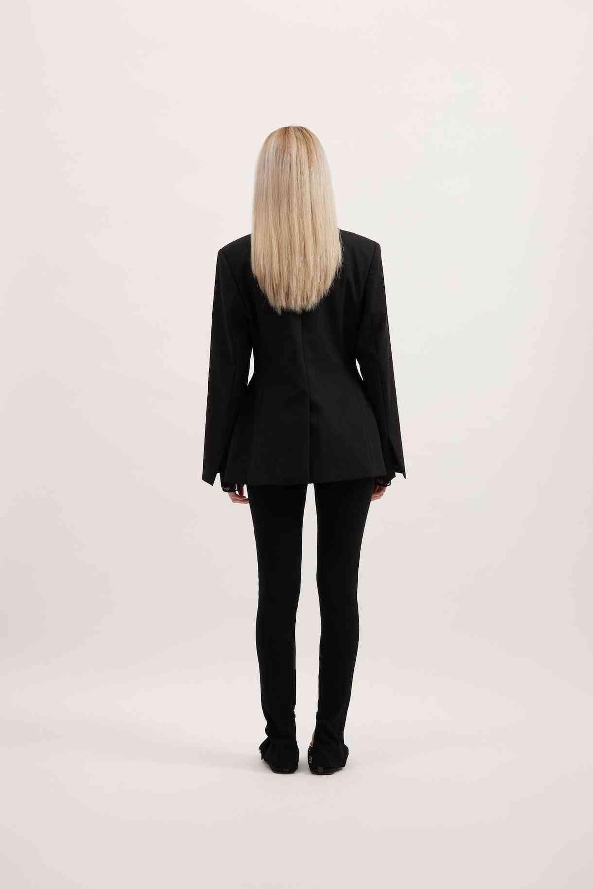 Back view of black Sofia blazer with long sleeves and structured tailored fit