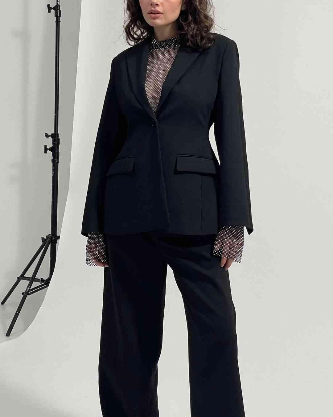 Dark Sofia blazer close-up with notch lapels and flap pockets