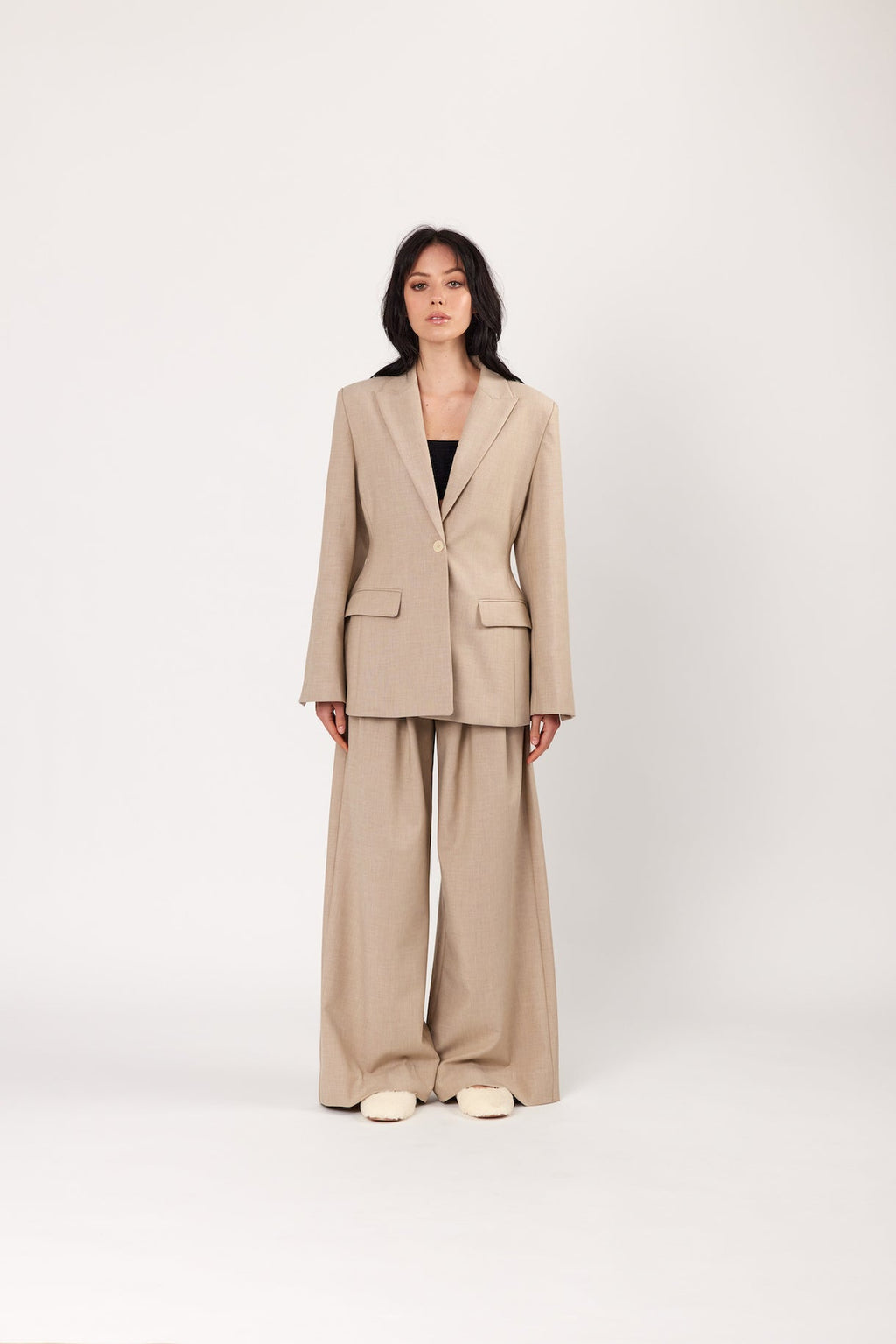 Oat tailored blazer with notch lapels, single-breasted front, and flap pockets