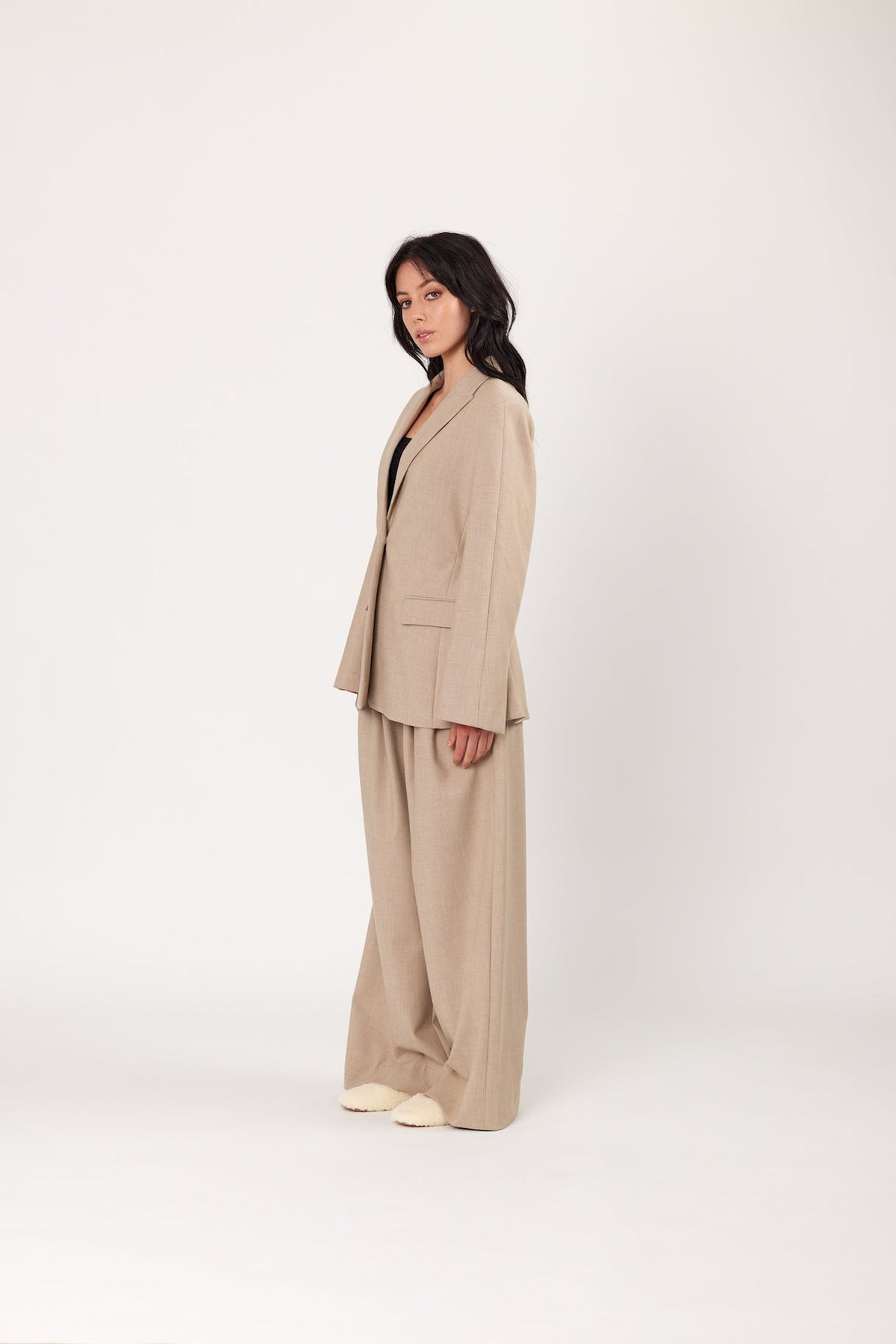Oat blazer three-quarter view with notch lapels and flap pockets