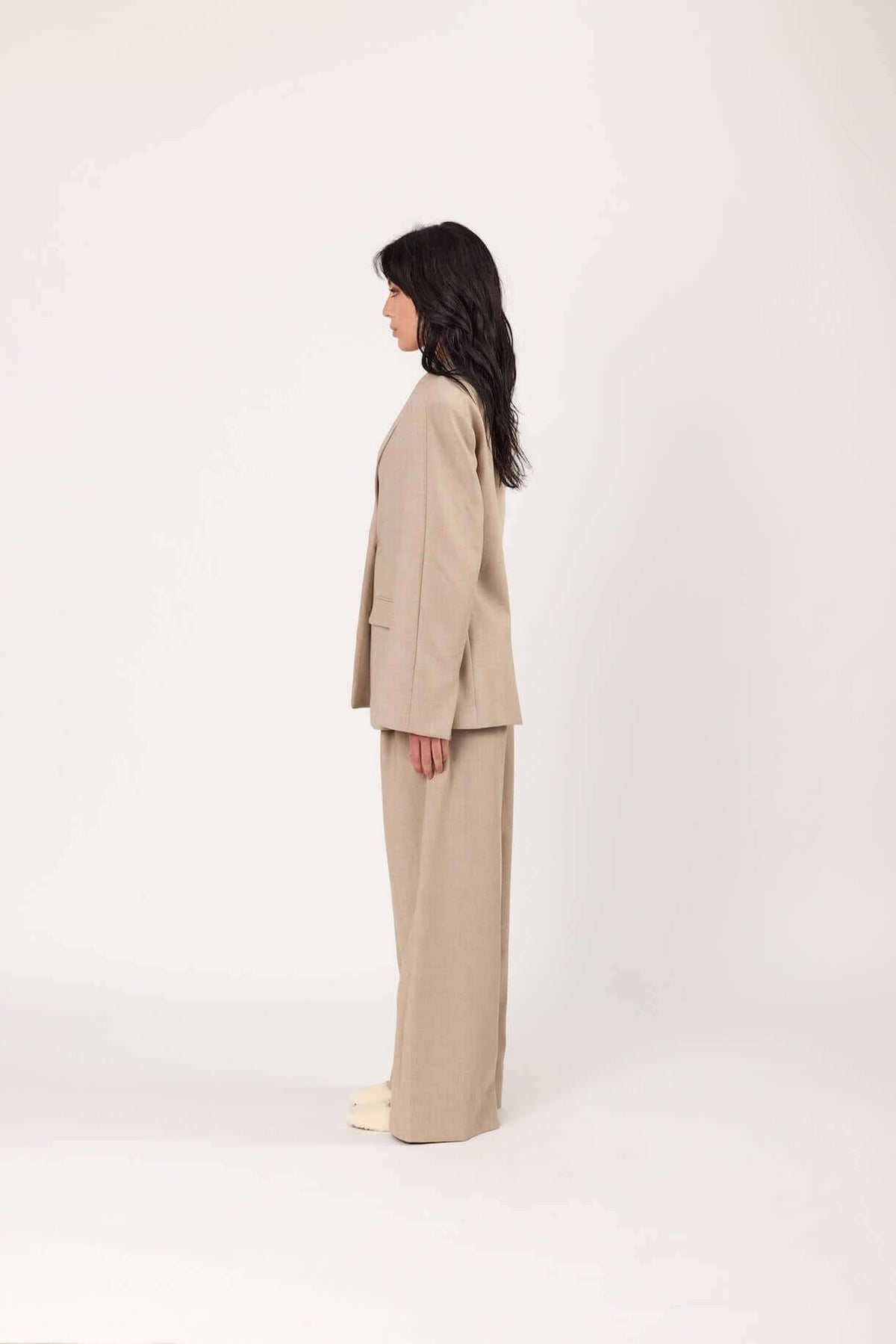 Oat blazer side view with notch lapels and flap pockets