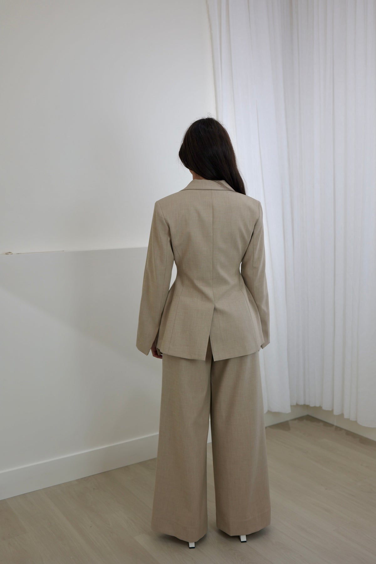 Oat blazer back view with long sleeves and clean tailored seams