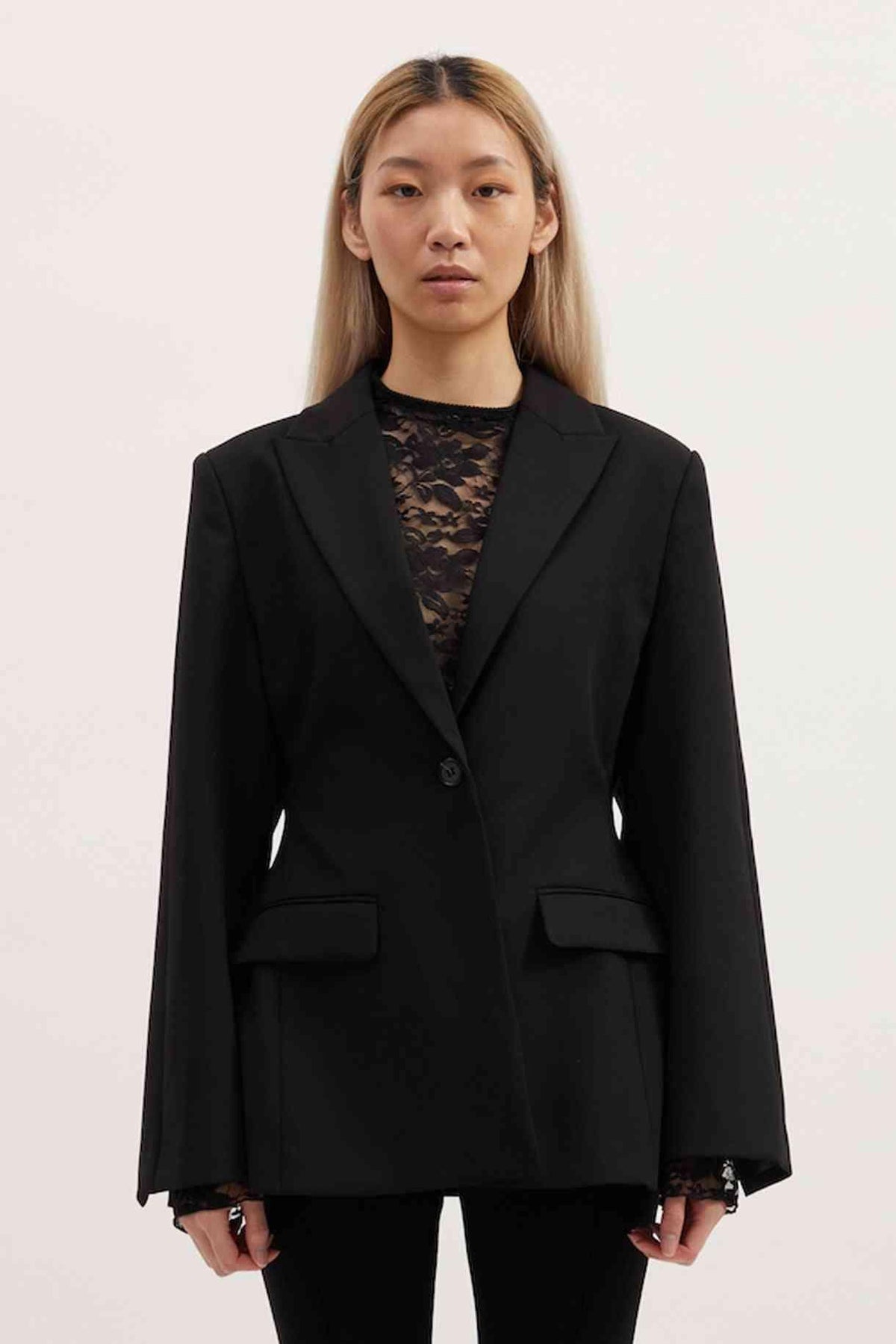 Black Sofia blazer with notch lapels, single-breasted front, and flap chest pockets
