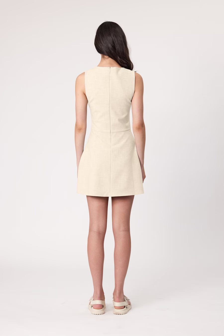 Bone sleeveless shift dress, back view with clean seam detailing