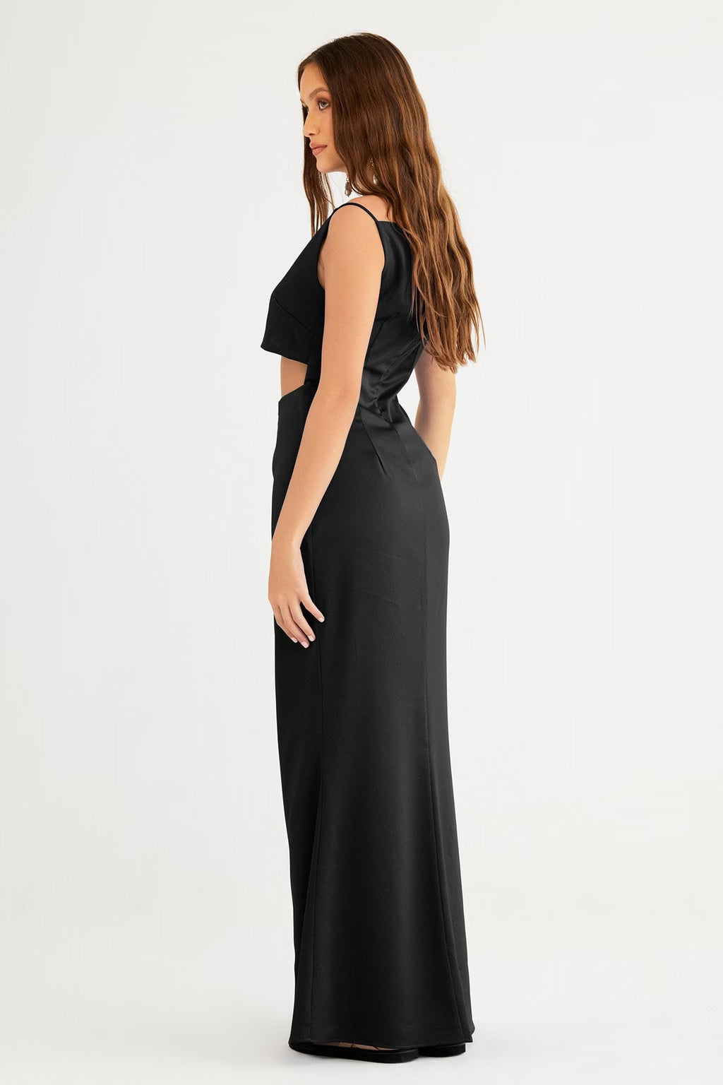 Black sleeveless crop-top gown with long column skirt, angled side view