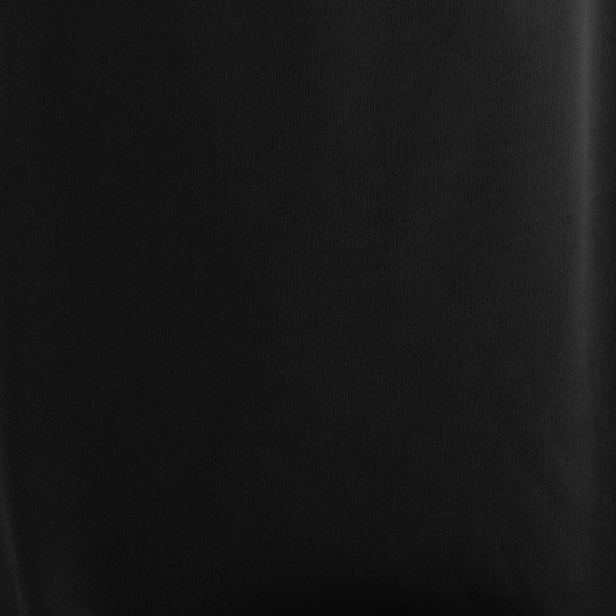 Black satin-like fabric close-up with smooth woven texture