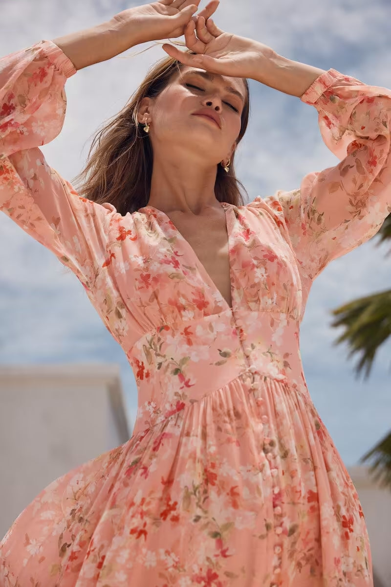Pink sheer midi dress with floral print, long puff sleeves, V-neck and gathered waist