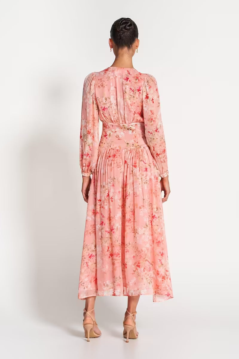 Pink sheer midi dress back view with floral print, gathered waist and long cuffed sleeves