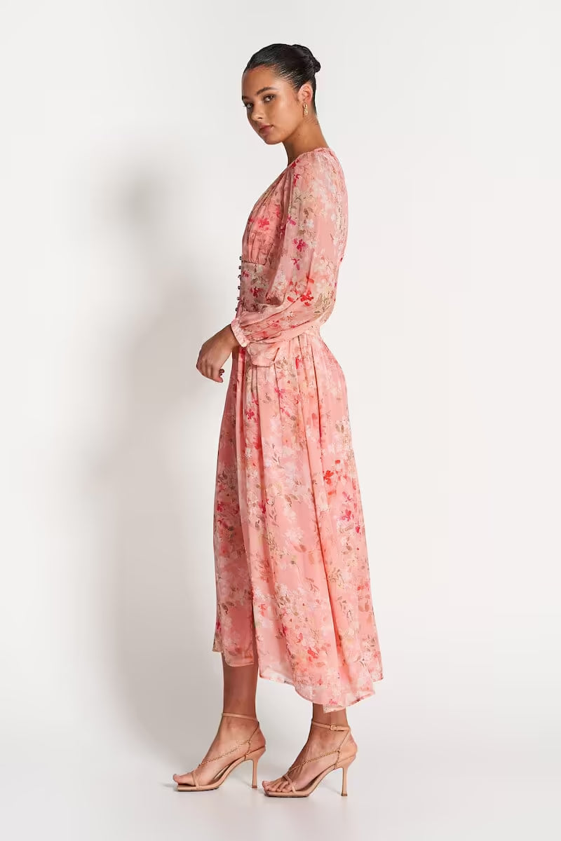 Pink sheer midi dress with floral print, long sleeves, fitted waist and midi length
