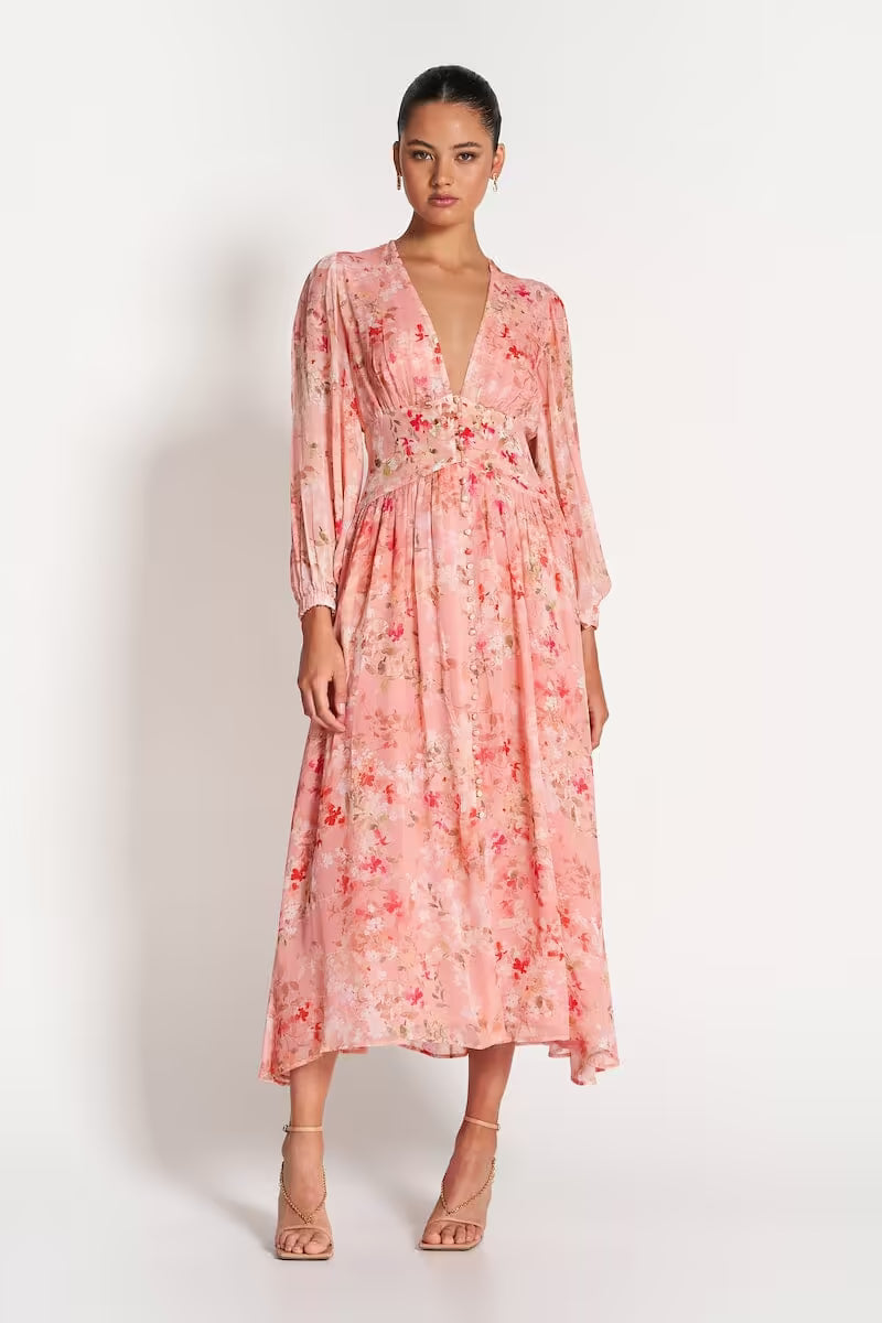 Pink sheer midi dress with floral print, V-neckline and flowing tiered midi skirt