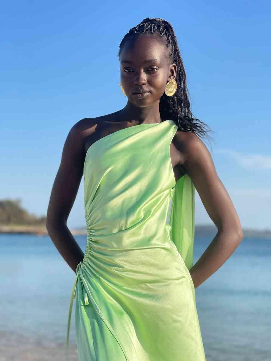 Light green halter maxi dress with gathered waist detail and side ruching at bust.