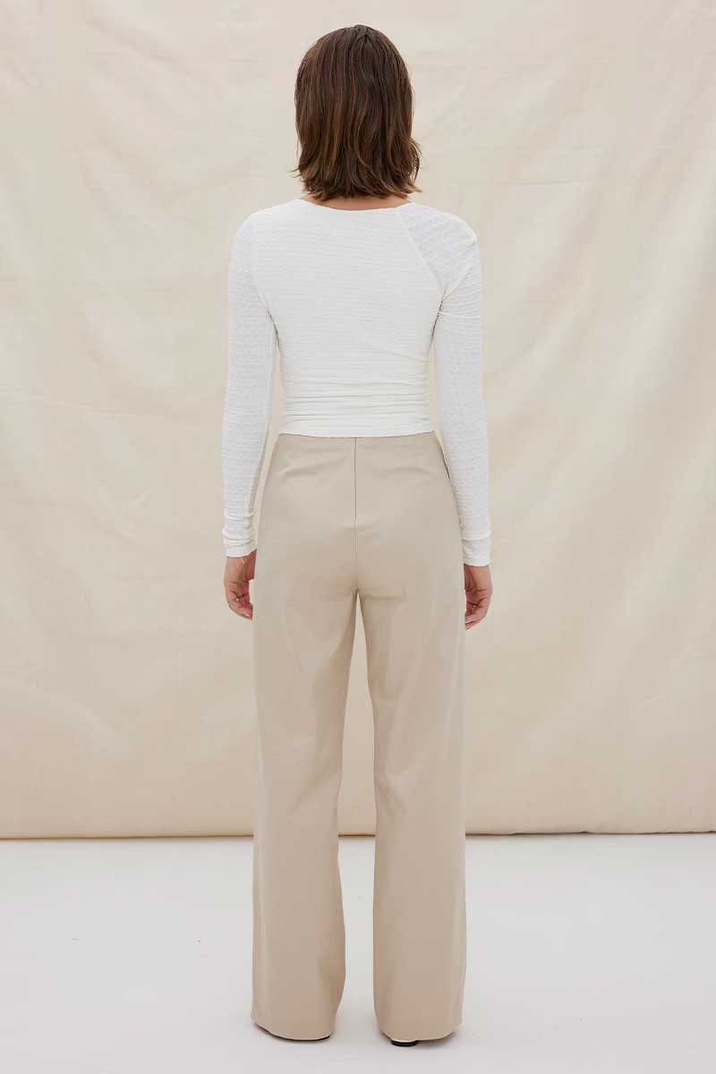 White one-shoulder ruched long-sleeve top, back view