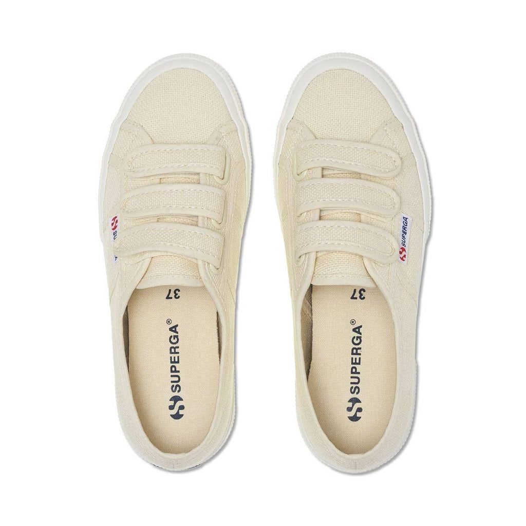 Pair of light beige canvas sneakers, front view with lace-up and Superga logo