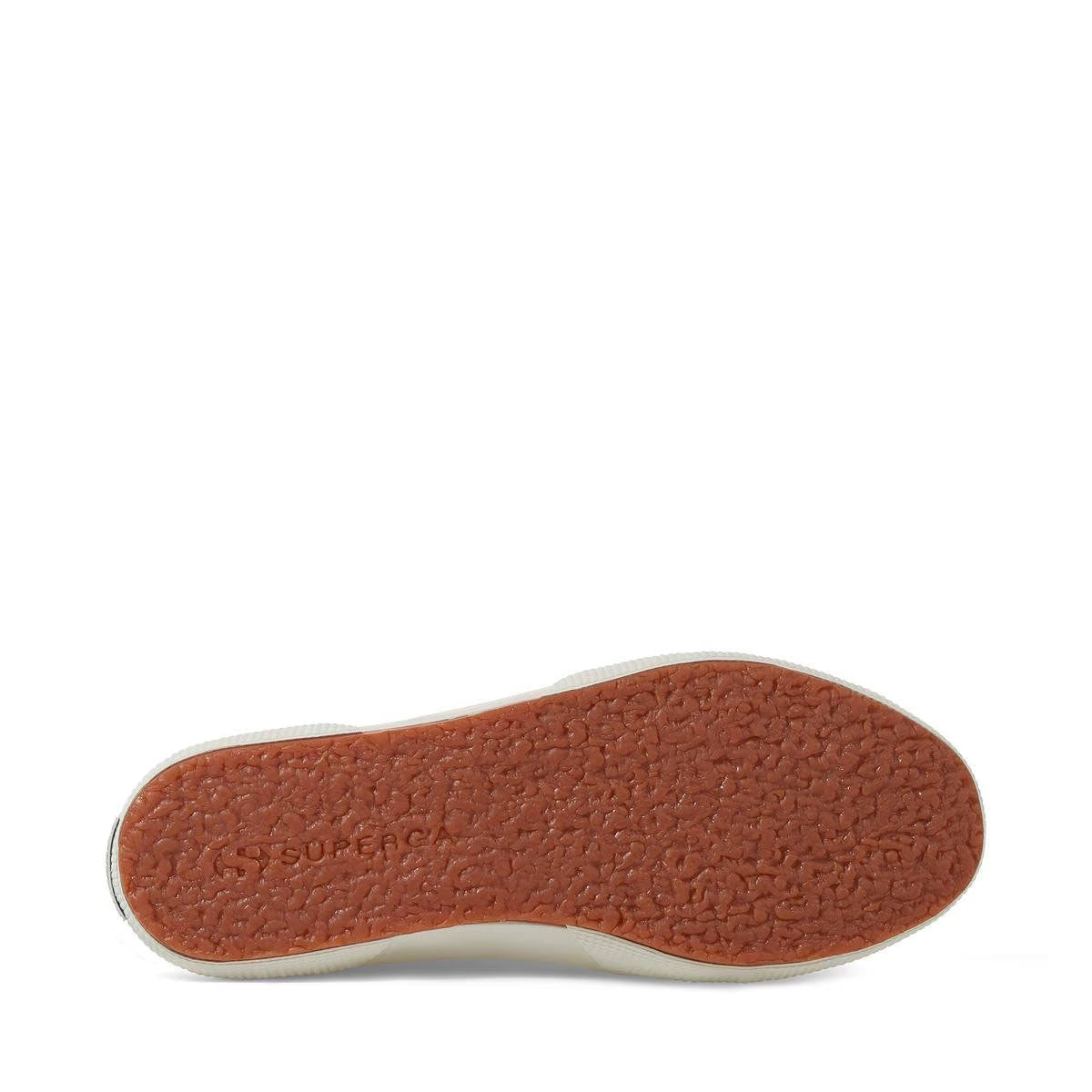Light beige sneaker outsole with textured brown tread and white edge
