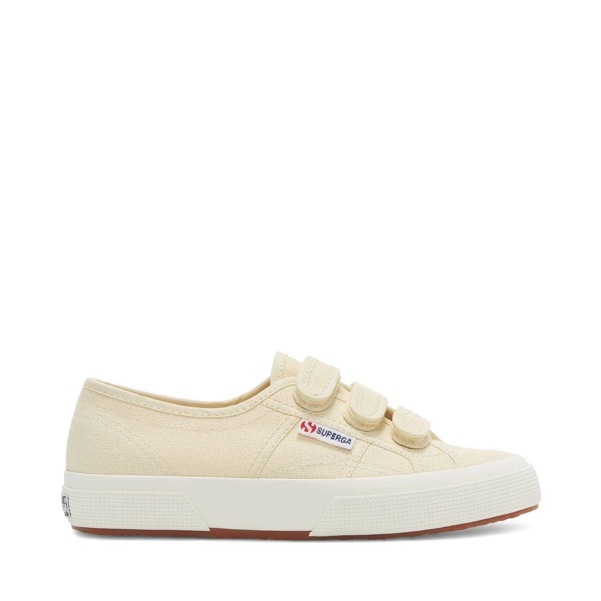 Light beige canvas sneakers with hook-and-loop straps and white rubber sole