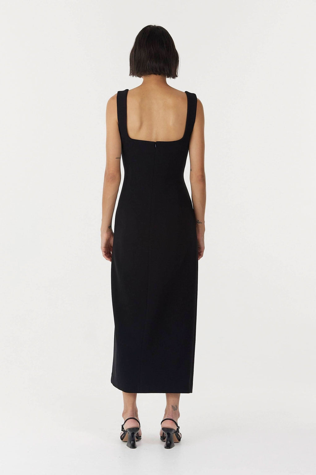 Black sleeveless square-back midi dress with thick straps and fitted shape