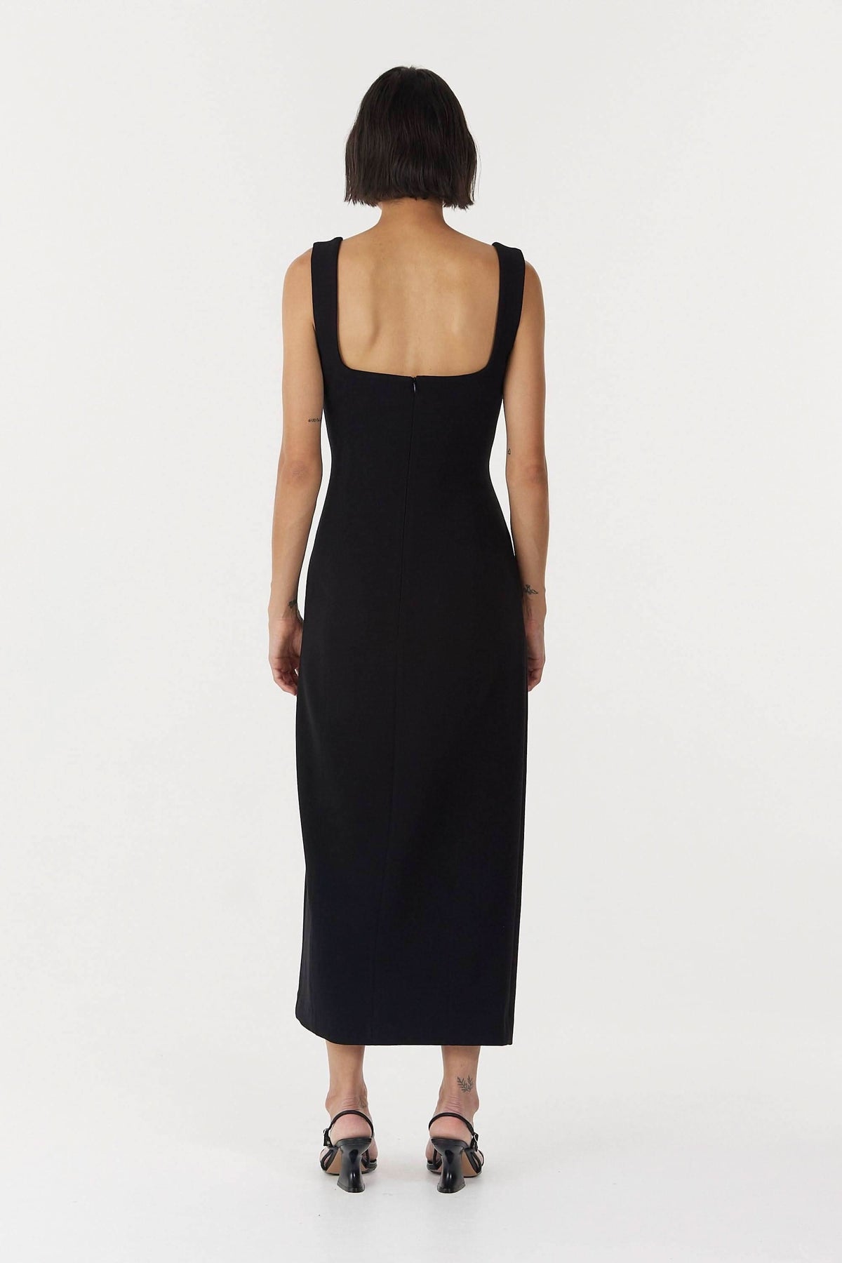 Black sleeveless square-back midi dress with thick straps and fitted shape