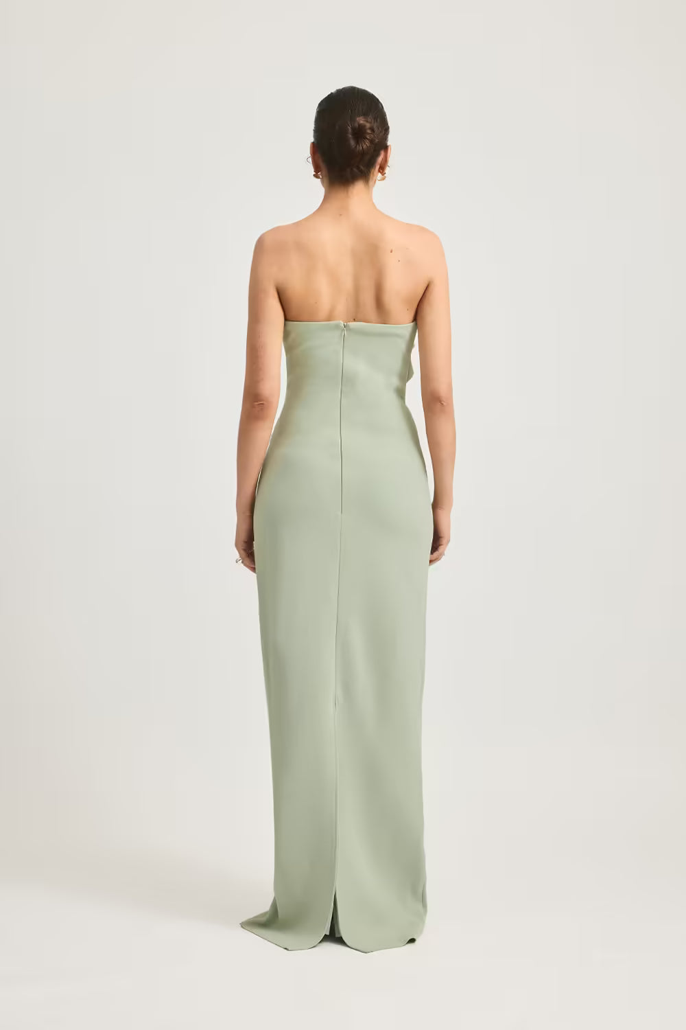 Sage green strapless column maxi dress, back view with center seam