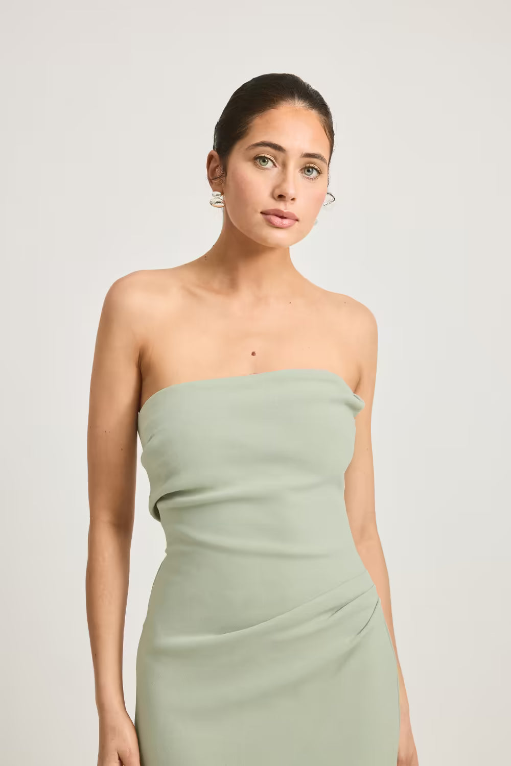 Sage green strapless dress bodice with draped neckline and gathered waist