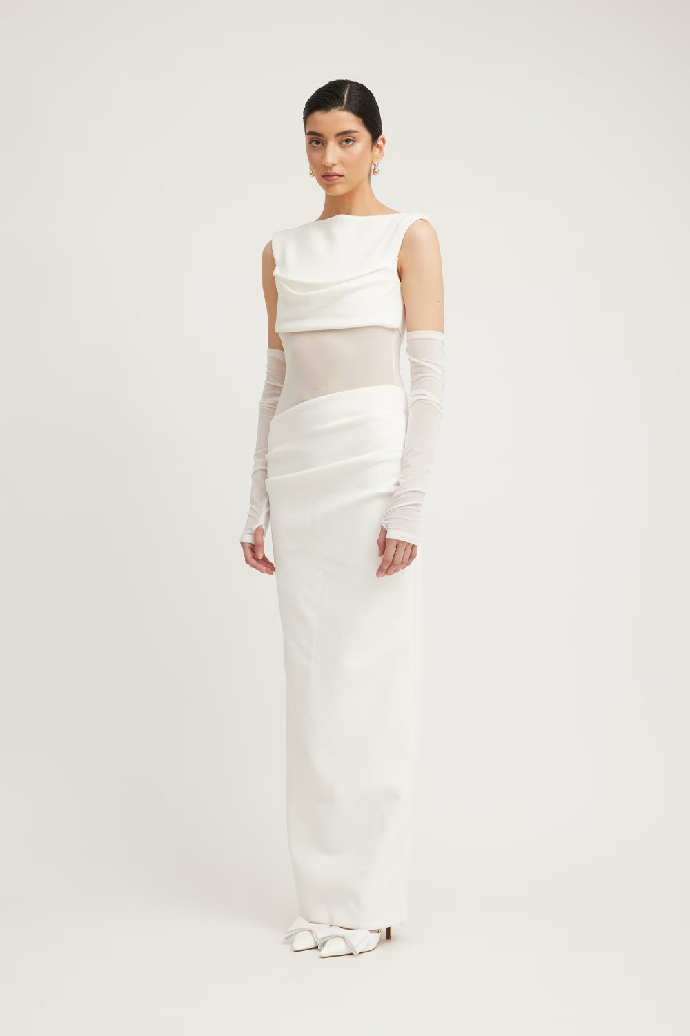 Ivory sleeveless dress with layered drape bodice and straight, floor-length fit