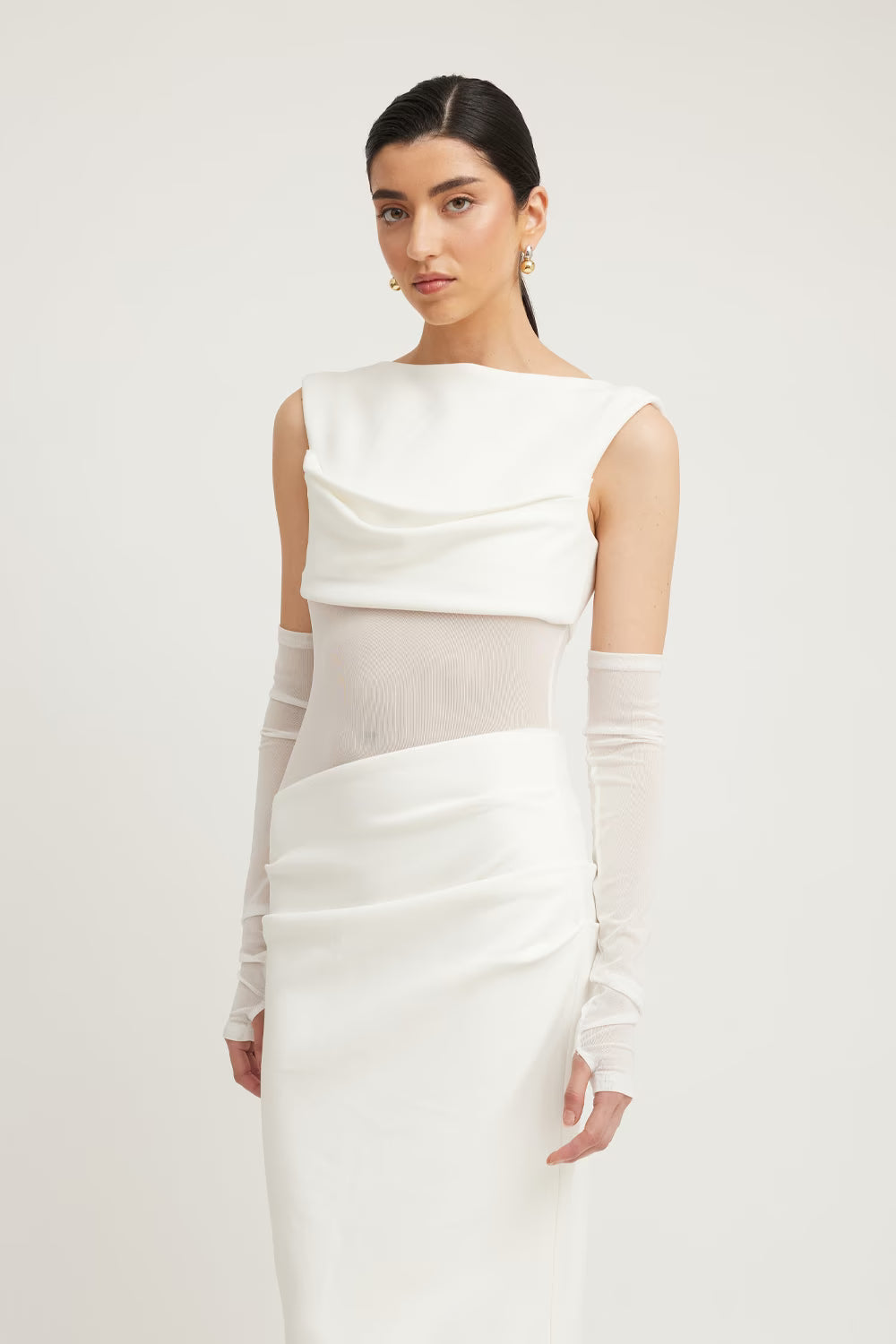 Ivory sleeveless dress with draped bodice and fitted waist panel detail